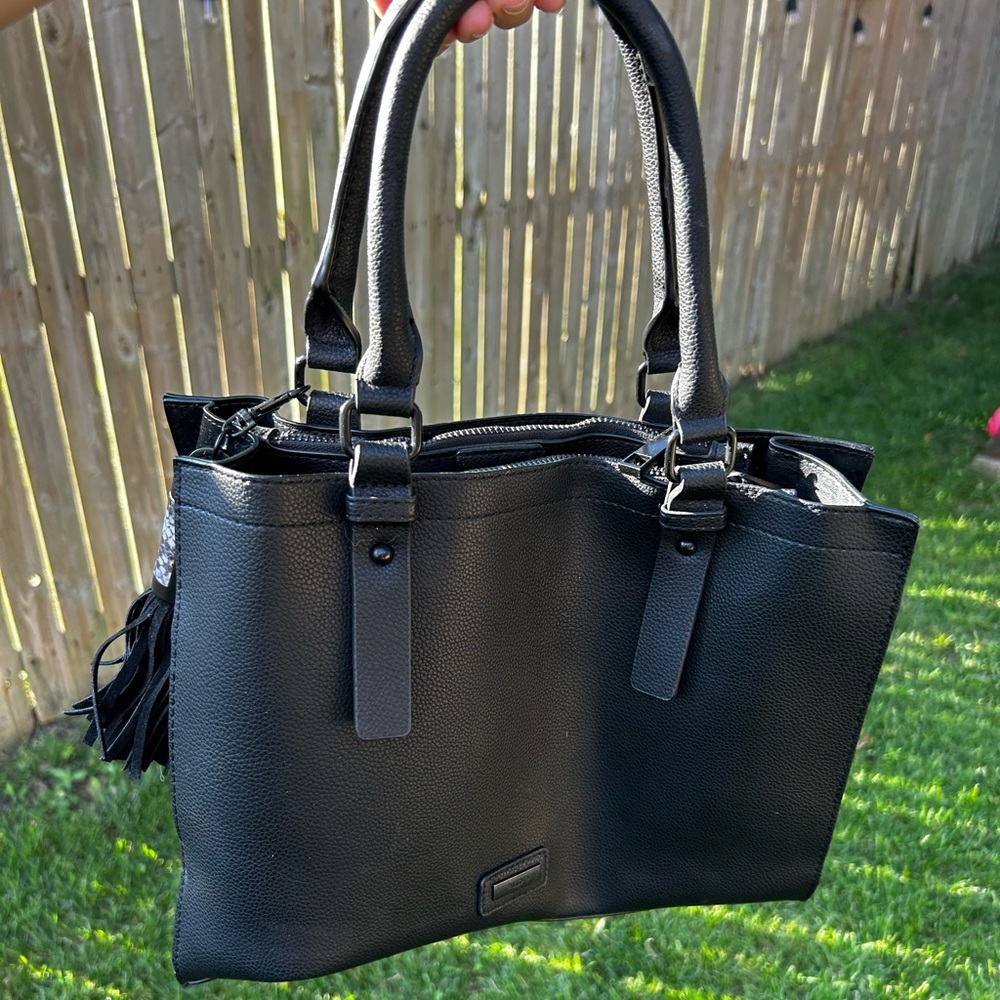 Black tote bag with 2 inside zipper pockets by Aldo.